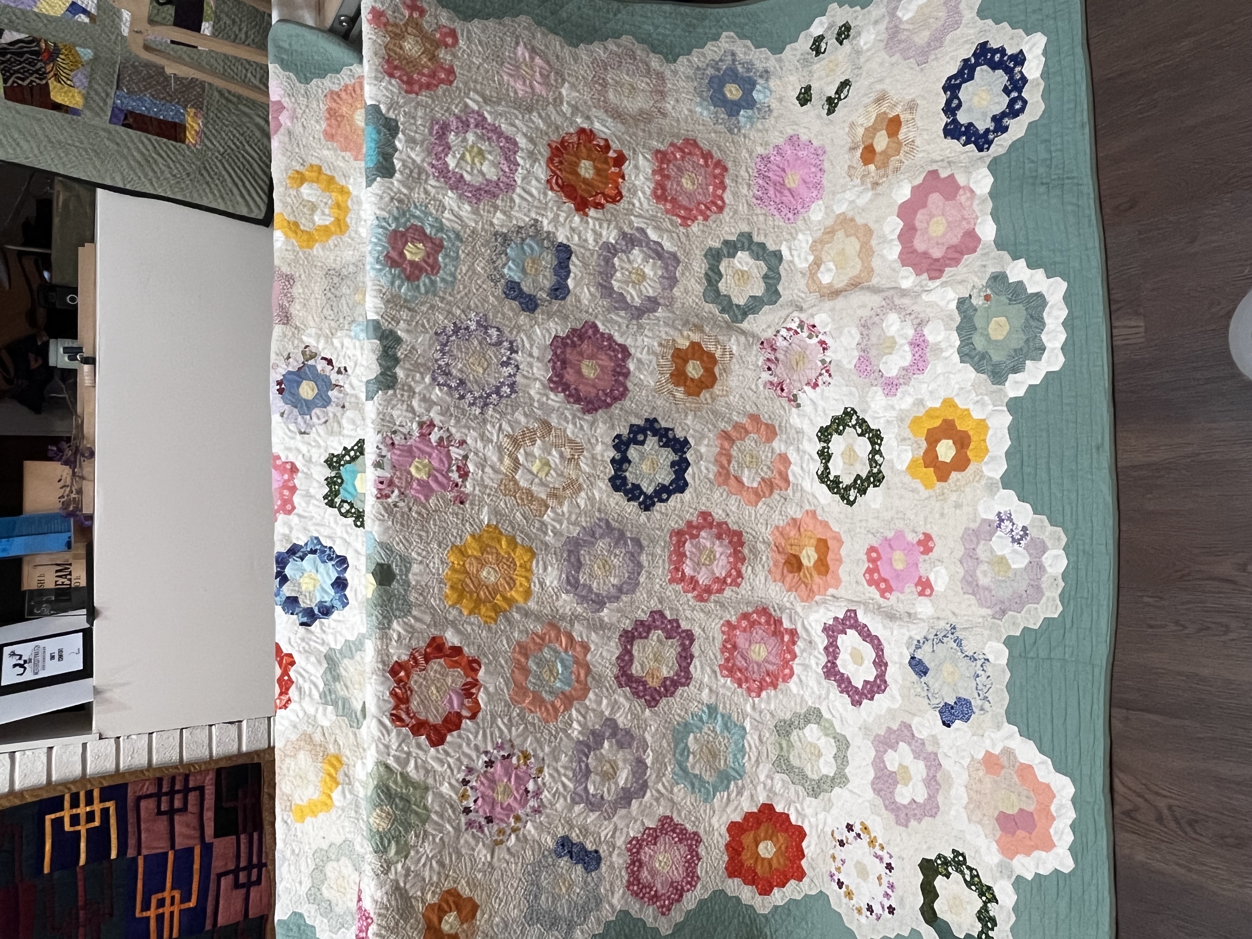 Completed hexagon quilt restoration — Grandmother’s Flower Garden style quilt