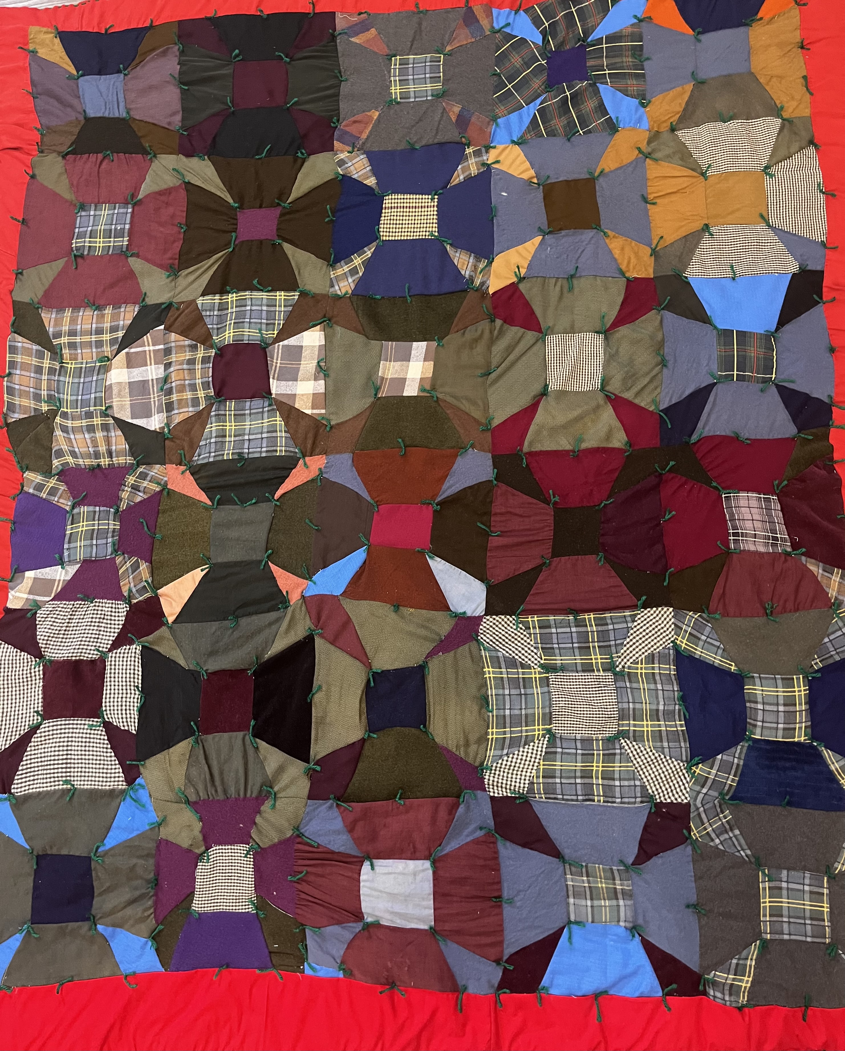 Wool and plaid quilt after restoration — complete and stabilized
